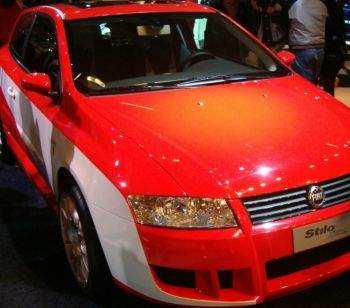 Red is the colour of racing and red was also the colour of the area at this month's Bologna Motor Show that housed two flame red Fiat Stilo 'M. Schumacher' cars