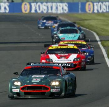 The pair of Care Racing supported Ferrari 550 Maranello sportscars are seen at Silverstone following behind the Peter Kox and Pedro Lamy, race-winning Aston Martin DBR9