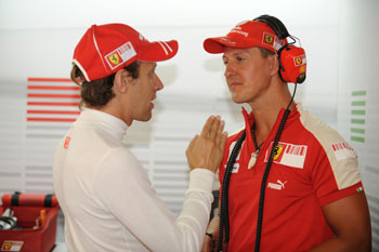 LUCA BADOER AND MICHAEL SCHUMACHER - 2009 EUROPEAN GRAND PRIX, VALENCIA