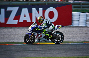 Valentino Rossi and Jorge Lorenzo finished second and third in the season-ending Grand Prix of Valencia on Sunday afternoon, the ninth time the pair have shared the podium this season. It ensured that Yamaha won the Triple Crown for the second year running after Rossi took the Riders' title, Fiat Yamaha the Teams' and Yamaha the Constructors'.