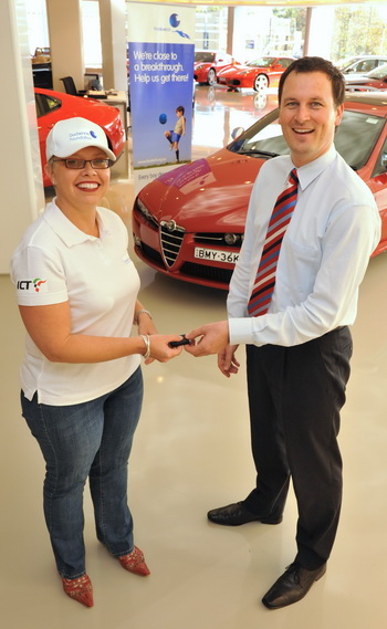 Tiina Raiko from the Duchenne Foundation collecting the keys to her Alfa Romeo 159 JTDm from Andrei Zaitzev, General Manager, Alfa Romeo Australia, in readiness for the start of the Italian Connection Trophy.