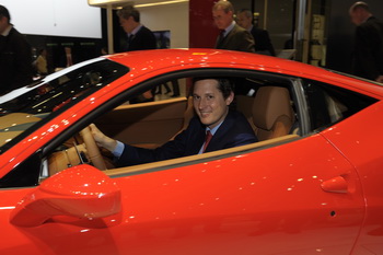 JOHN ELKANN TRIES OUT THE FERRARI 458 ITALIA AT THE 2010 GENEVA MOTOR SHOW