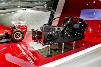 The Ferrari display in Paris is showcasing its new and advanced supercar destined carbon fibre chassis as well as the five sports cars that make up the current range, each of which represents the present generation of its 8- and 12-cylinder models. 