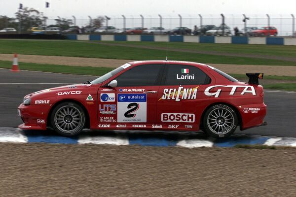 the Alfa Romeo 156 GTA Super Touring car, seen here in the hands of Nicola Larini, which won the European Touring Car Championship, will be displayed in Bologna