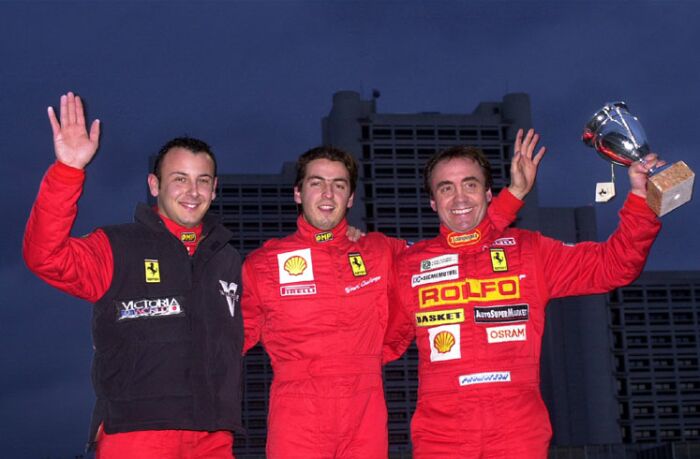 the winners of the Ferrari 360 Modena Challenge celebrate in Bologna