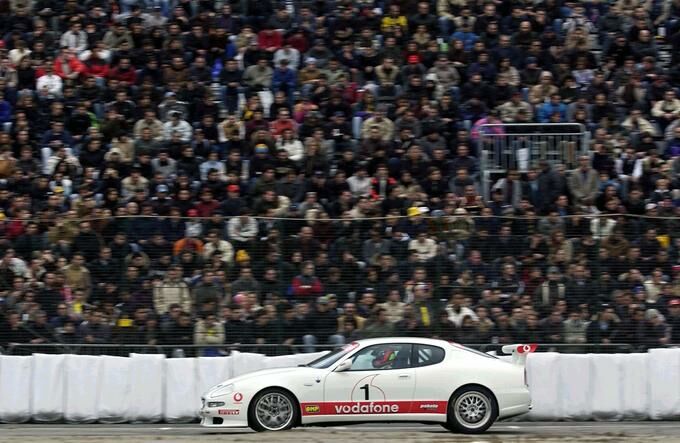 Ferrari F1 test driver Luciano Burti with the Maserati Trofeo at the 2002 Bologna Motor Show