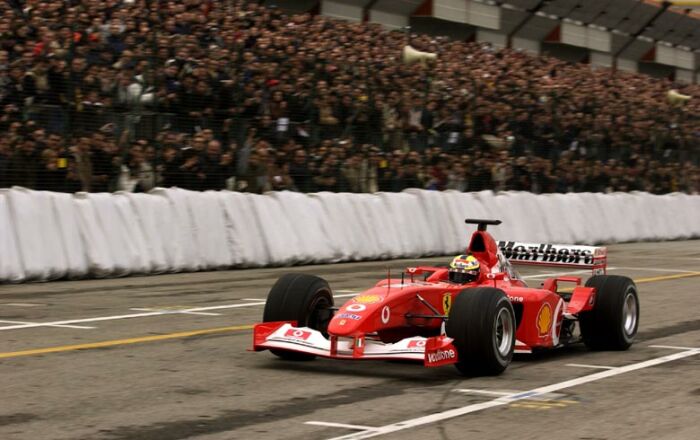 Track action with the Ferrari F2002 at the Bologna Motor Show