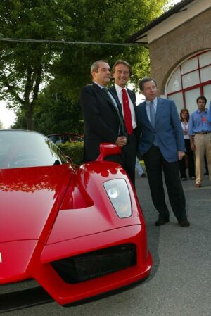 Luca di Montezemolo, Jean Todt and Amadeo Felisa pose with the Enzo Ferrari for the press
