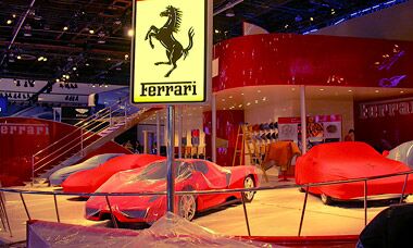 Ferrari ready their stand at the 2003 Detroit Motor Show