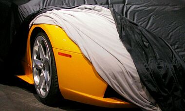 Lamborghini Murcielago peeks from beneath its covers in Detroit