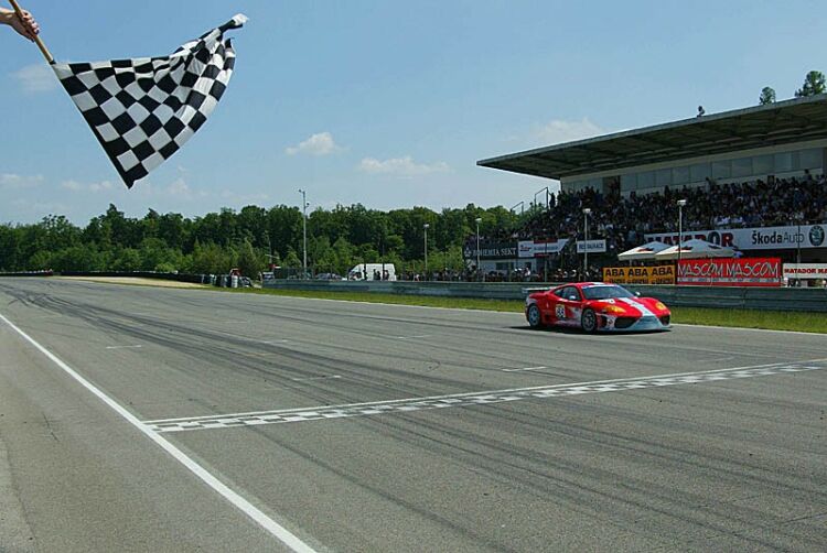 Le Mans GTS class winner Jamie Davies and Tim Mullen cross the line to take place third for Team Maranello Concessionaires in N-GT at Brno in the FIA GT series