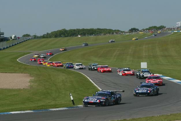 The Force One Festina Chrysler Viper's lead the field round on the opening lap of the last FIA GT series race at Donington Park