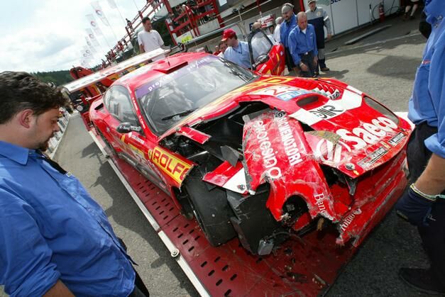 the crashed no23 BMS Ferrari 550 Maranello returns to the pits. The team will be making frantic efforts to repair the car in time for tomorrow's race