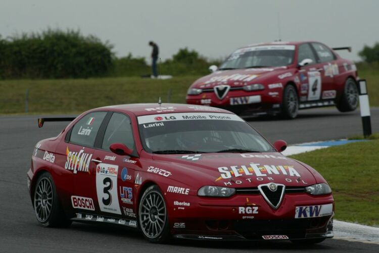 Nicola Larini leads Autodelta Alfa Romeo team mate Gabriele Tarquini at Donington Park. Despite Tarquini's failure to score points in race two he retains the series lead after ten races