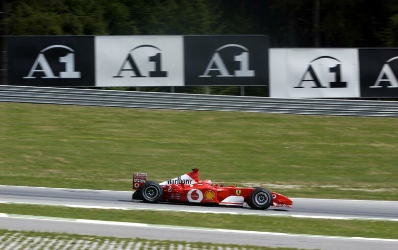 Michael Schumacher powering his way to a win he was gifted when Team orders came into play