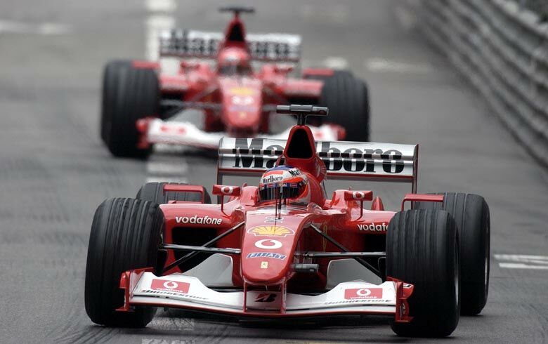 Rubens Barrichello leads Michael Schumacher around the track during qualifying