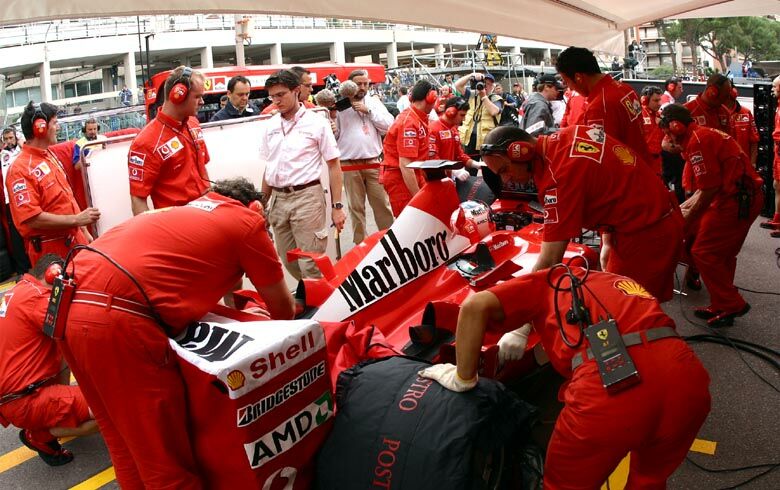 Rubens Barrichello's Ferrari F2002 is worked on in the pits during practice
