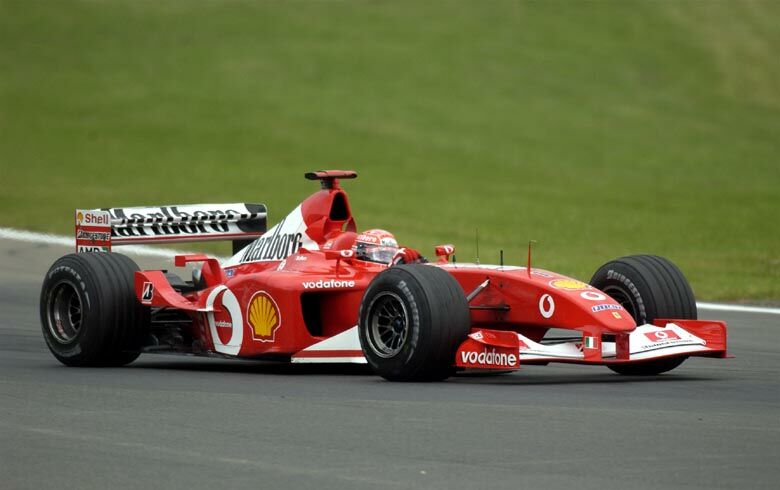 Michael Schumacher pressurised Rubens Barrichello towards the end of the race, but held station to finish in second place