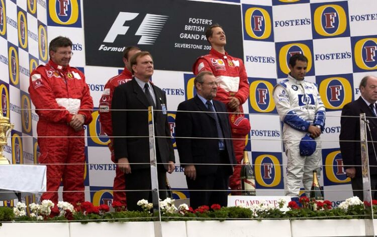 winner Michael Schumacher is flanked by second placed Rubens Barrichello and third placed Juan Pablo Montoya