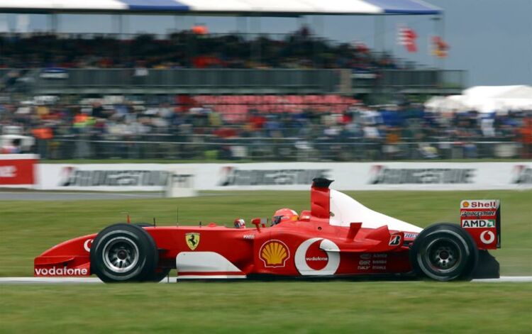 after disposing of Juan Pablo Montoya, Michael Schumacher was never troubled in the rain hit British Grand Prix, cruising to victory on a circuit where he has never had much luck