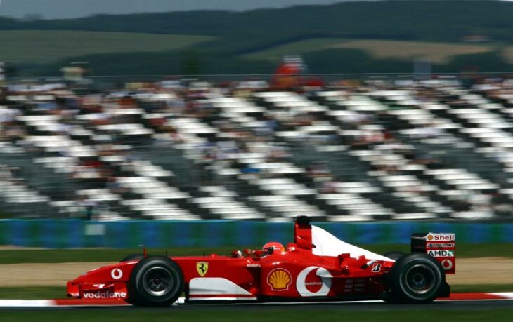 it was a somewhat gifted win for Ferrari driver Michael Schumacher when Kimi Raikkonen made an error four laps from the flag