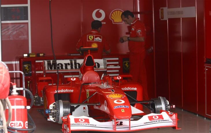 Michael Schumacher's car sits in the pit garage during a free practice session for the German Grand Prix