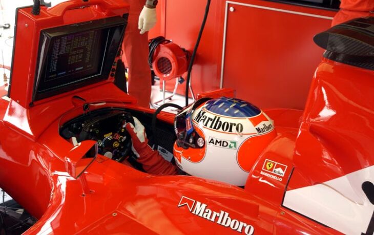 Rubens Barrichello sits in his Ferrari F2002