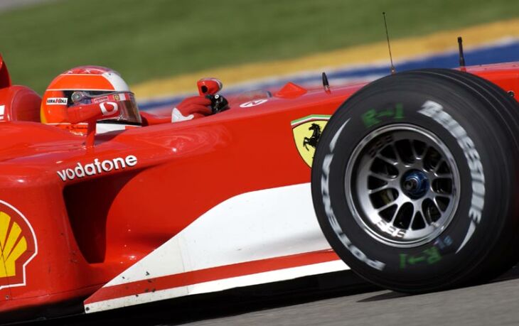 Michael Schumacher hard at work at the wheel of his Ferrari F2002