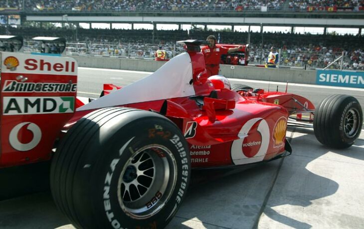 Rubens Barrichello leaves the Ferrari pit garage during qualifying