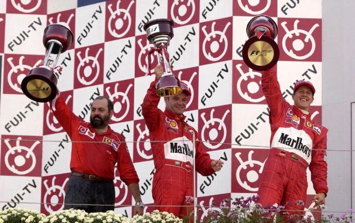 the Ferrari drivers on the podium