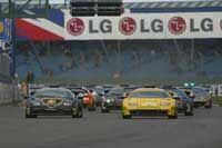 At the Silverstone start the black Lamborghini VIP car, driven by Tiff Needell disputes the lead with the bright yellow Corona-backed Diablo of Jean-Marc Gounon