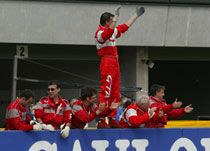 the Nordauto Alfa Romeo team celebrate Fabrizio Giovanardi's victory