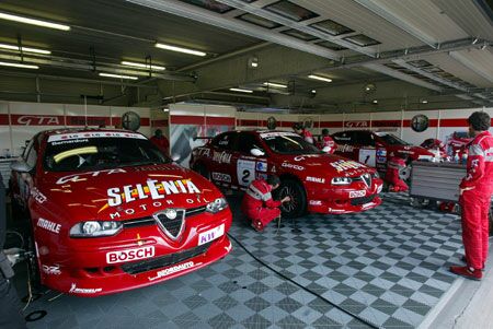 the Nordauto Alfa Romeo 156 GTA's of Fabrizio Giovanardi, Nicola Larini and Romana Bernadoni sit in their garage