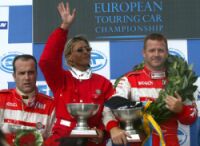 Alfa Romeo driver Nicola Larini celebrates his race one win