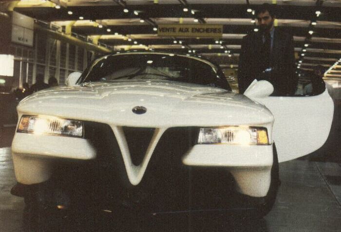 the Castagna Vittoria's designer Gioacchino Acampora poses with the car